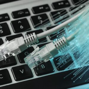 blue-optic-fiber-with-ethernet-cables-laptop